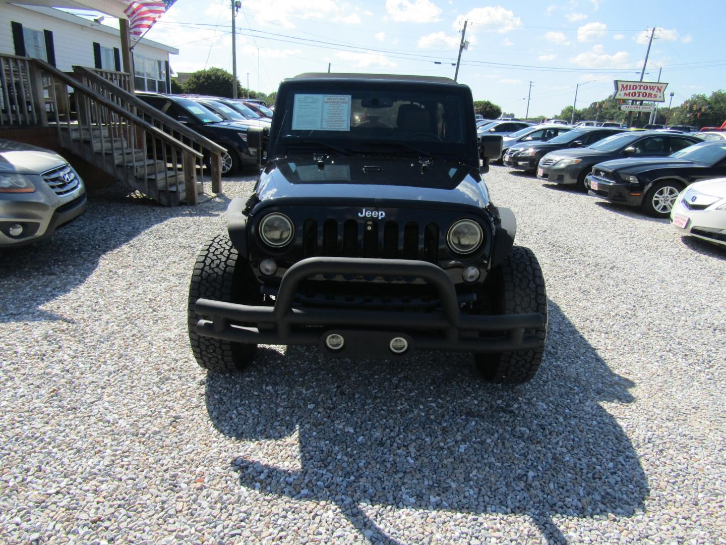 2015 Black /Tan Jeep Wrangler (1C4BJWDG8FL) with an V6 engine, Automatic transmission, located at 15016 S Hwy 231, Midland City, AL, 36350, (334) 983-3001, 31.306210, -85.495277 - Photo#1